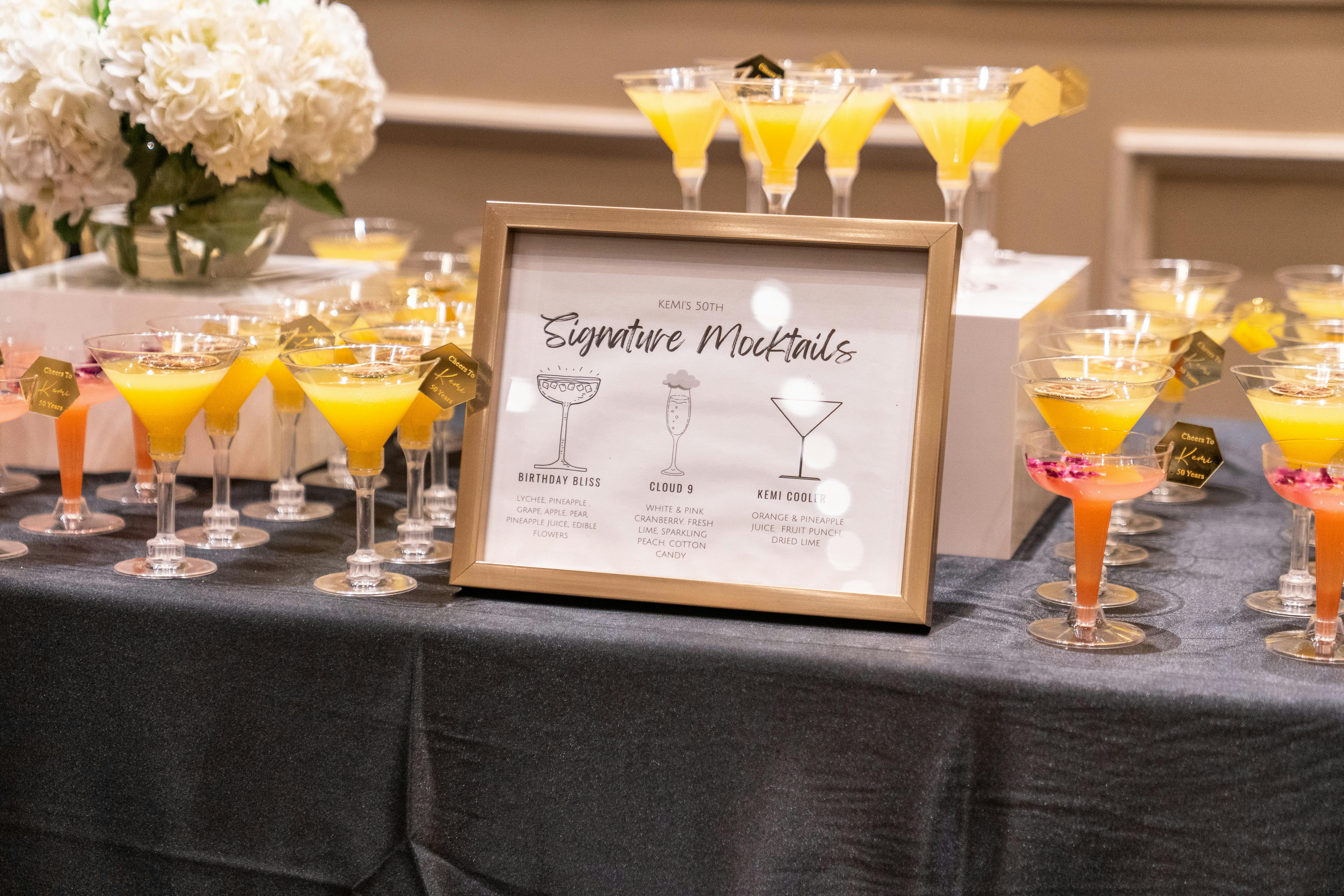 Stylish happy bride and groom toasting with glasses of champagne and having fun