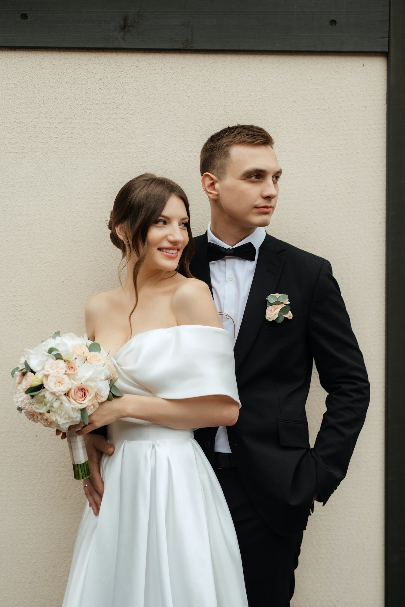 young couple bride and groom in a white short dress