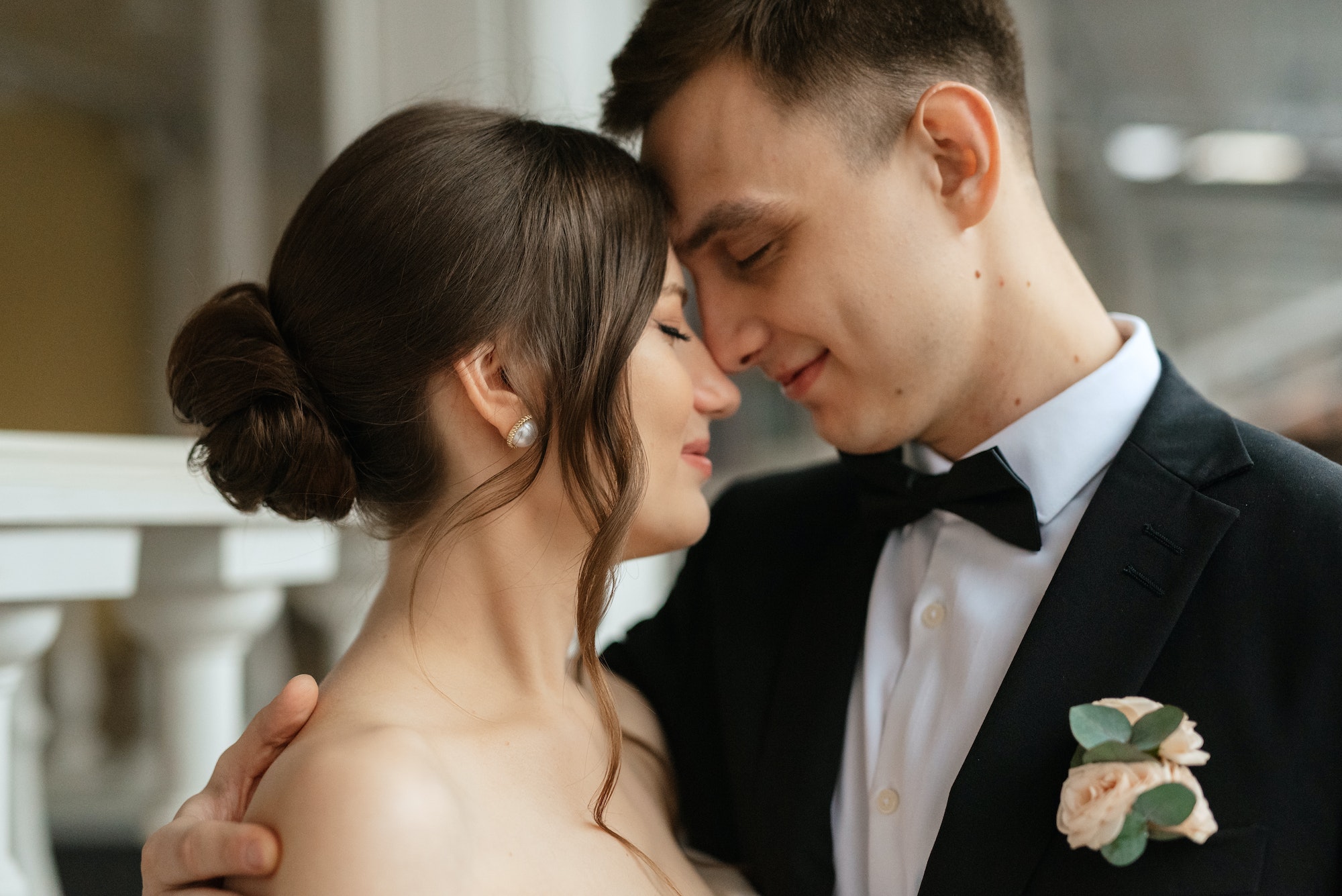 young couple bride and groom in a white short dress