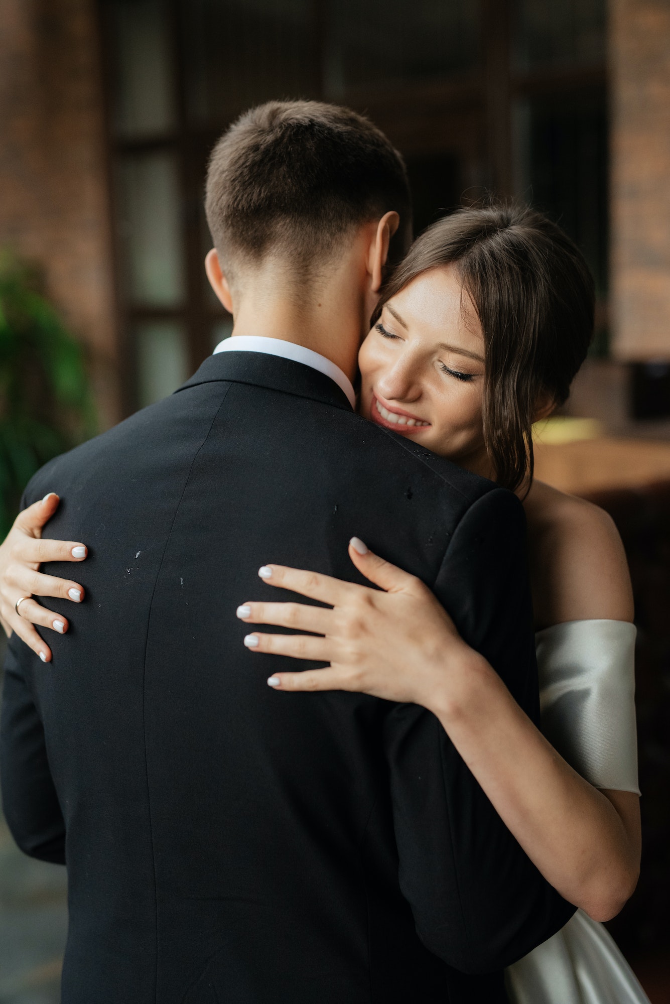 young couple bride and groom in a white short dress