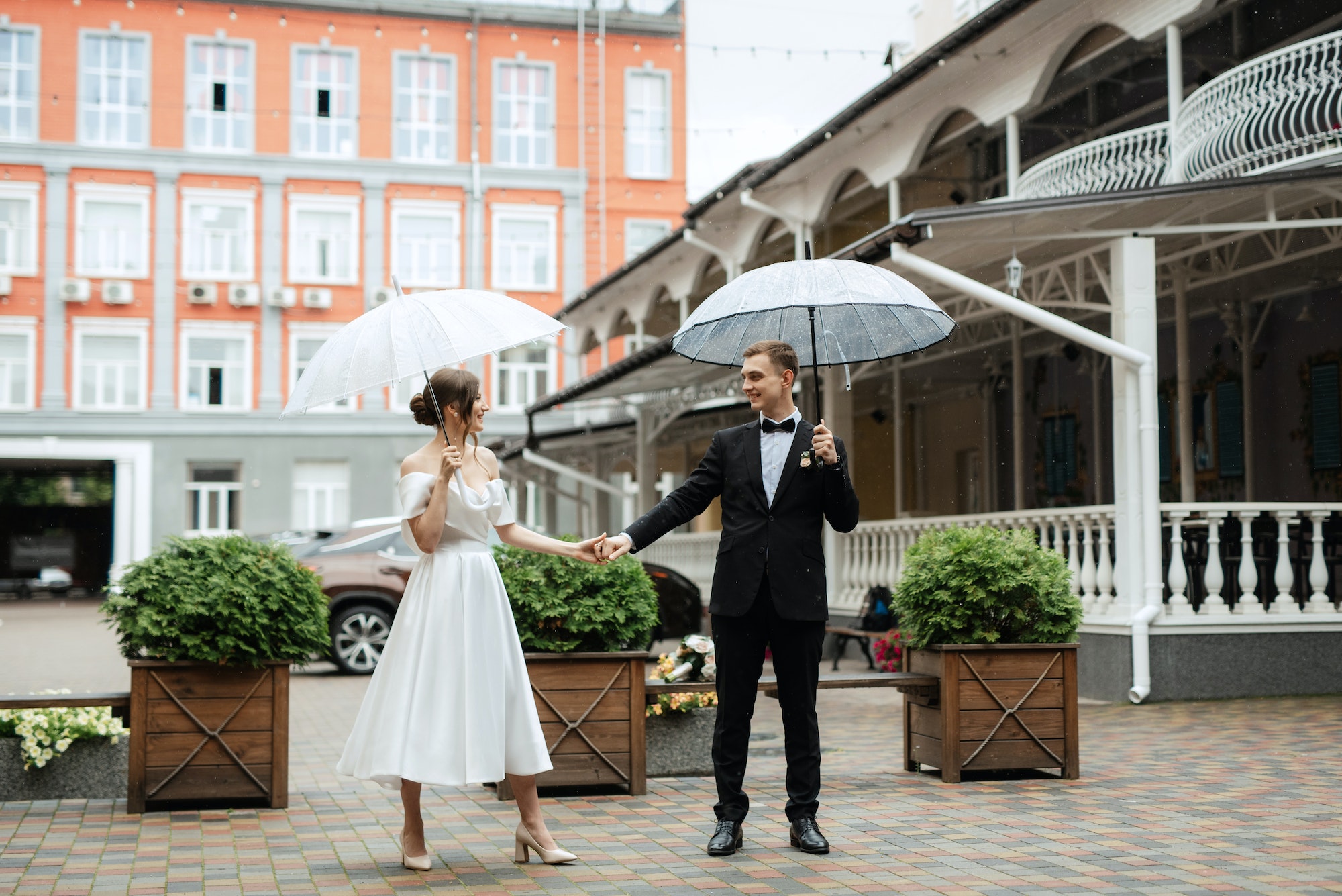 young couple bride and groom in a white short dress
